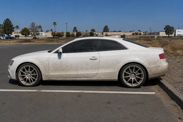 Dirty white coupe before exterior car detailing